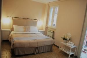 En eller flere senge i et værelse på Appartamenti del Borgo