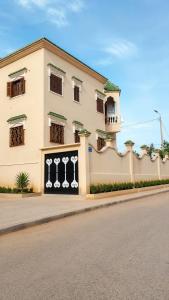 a building on the side of a street at Villa ben lahbib II in Khenifra