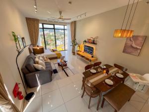 a living room with a couch and a table and chairs at Georgetown#Beacon Executive Suite SkyPool#Luxury&Glamorous Suite#2BR#Living Room with Queen Bed in George Town