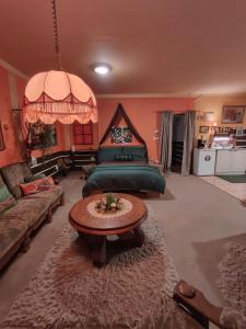 a living room with a bed and a coffee table at Pension Relax in Litoměřice