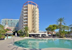 a hotel with a swimming pool in front of a building at SOL by Meliá Katmandú Park and Resort in Magaluf