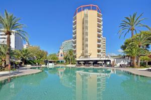 a large swimming pool in front of a tall building at SOL by Meliá Katmandú Park and Resort in Magaluf