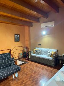 a living room with a couch and a table at Can Mariano in Mollet de Perelada