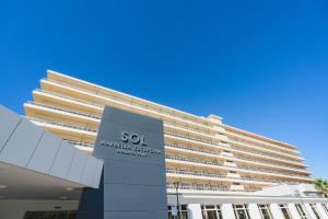 a building with a sign in front of it at SOL by Meliá Marbella Estepona - Atalaya Park in Estepona