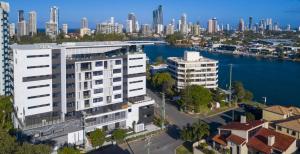 an aerial view of a city with a river and buildings at Peninsular Gold Coast in Gold Coast