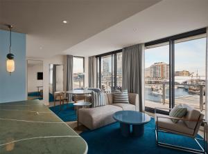 a hotel room with a view of the city at Adina Sydney Darling Harbour in Sydney