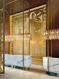 a room with a wall with a painting on it at Paradisus by Meliá Cancún -All Inclusive in Cancún