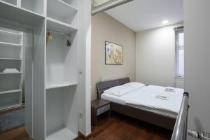 Apartments Zagreb Point - Vinogradska tesisinde bir odada yatak veya yataklar