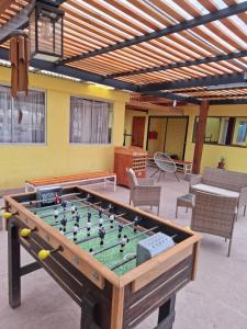 a pool table in the middle of a patio at Hostal Inti Wasi in San Pedro de Atacama