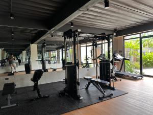 a gym with several treadmills and exercise bikes at RECA Resort Philippines Luxury Villas & Nature Retreat in Porac