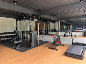 a gym with several treadmills and cardio equipment at RECA Resort Philippines Luxury Villas & Nature Retreat in Porac +7 photos