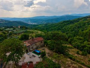 an aerial view of a house on a hill at Tuscany House Retreat in Casentino in Subbiano +15 photos