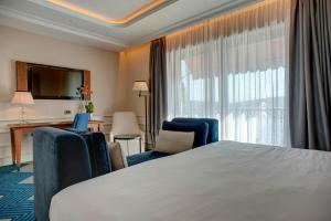 Postel nebo postele na pokoji v ubytování Boutique Hotel La Roche