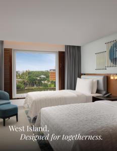 a hotel room with two beds and a window at Le Meridien Kochi in Cochin