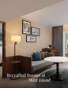 a living room with a couch and a table at Le Meridien Kochi in Cochin