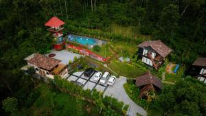 an overhead view of a house with a swimming pool at Wood Panda Luxury Resort Wayanad in Meppādi