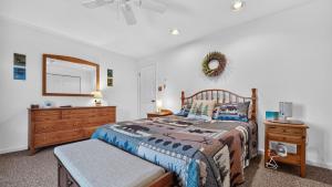 a bedroom with a bed and a dresser and a mirror at Uncas by AvantStay in North Creek +42 photos