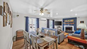 a dining room and living room with a table and a couch at Uncas by AvantStay in North Creek