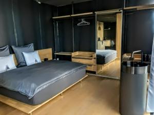 a bedroom with a bed and a mirror at Design apartmán in Teplice