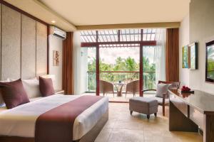 Kama o mga kama sa kuwarto sa Jie Jie Beach Hotel
