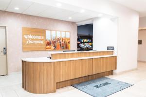 a welcome counter at a welcome tohammachi store at Hampton Inn & Suites Addison in Addison