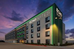 a building with a sign on the side of it at ECHO Suites Extended Stay by Wyndham Houston Katy West in Katy