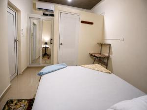 a bedroom with a large white bed in a room at Vista colonial suite in Comayagua +4 photos