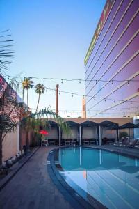 a swimming pool in front of a building at Ahern Hotel and Event Center in Las Vegas