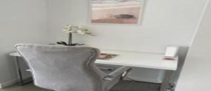 a white desk with a chair and a plant on it at Dalgety 104 in Townsville +9 photos