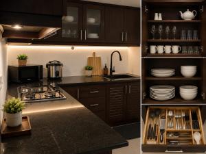 a kitchen with a sink and a stove top oven at Oval View Residencies in Yakbedda