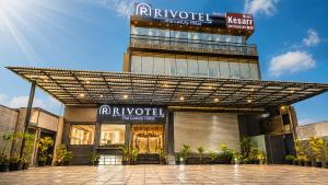 a facade of a building with a sign on it at Rivotel The Luxury Hotel in Chākan
