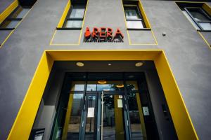 a building with a door and a sign on it at Brera Serviced Apartments Ulm in Ulm