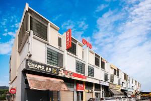 a building with cars parked in front of it at Hotel O Crystal City Hotel in Kuantan