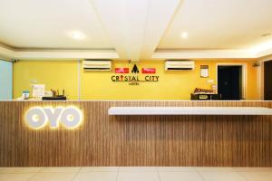 an office lobby with an oo sign on the wall at Hotel O Crystal City Hotel in Kuantan