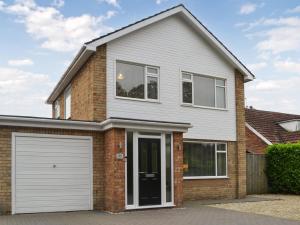 a brick house with a white garage at Oceans 44 in Bridlington