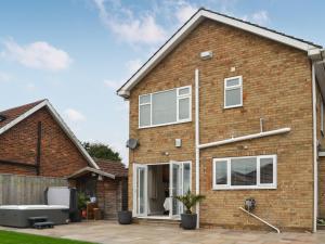 a brick house with a patio at Oceans 44 in Bridlington