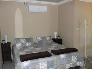 a bedroom with a bed in a room at ASAMé @ Oppi-Rivier in Christiana +7 photos