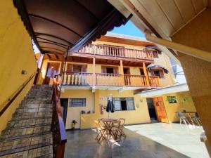 a view of a building from the hallway of a house at Pousada Heron in Campos do Jordão