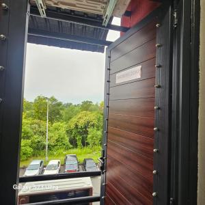 a view out of a train door with a window at B&B By JumStay in Sepang