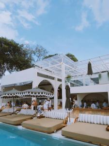 a resort with a swimming pool and a swimming pool at Rockstar Beach Apartments in Bangrak Beach
