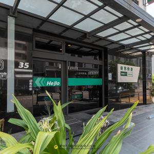 a building with a sign in front of it at CHECK inn Express Taichung FuXing Hall 2 in Taichung
