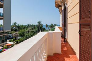 a balcony of a building with a view of a city at Maison 31 - Unique Experience in Civitavecchia