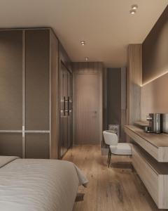 a hotel room with a bed and a bathroom at West Hill Apart Hotel in Kopaonik
