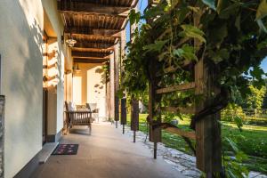 an entrance to a house with a pergola at Posestvo Laz - The Laz Estate in Voglarji