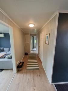 a hallway of a house with a stairway at Koselig hus med flott utsikt in Vossevangen