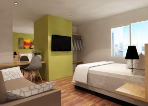 Een TV en/of entertainmentcenter bij Front One Hotel Jayapura
