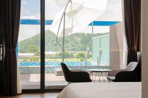 a hotel room with a view of a pool at Sanbangsan Hotel in Seogwipo