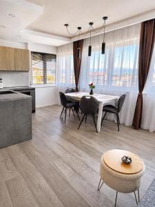 a kitchen and dining room with a table and chairs at 7 SKY UDINE in Udine