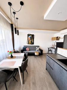 a living room with a couch and a table at 7 SKY UDINE in Udine +13 photos