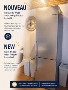 a refrigerator in a room with two trash cans at La Maisonnette - 2 chambres, parking, jardinet & calme in Tournai +21 photos